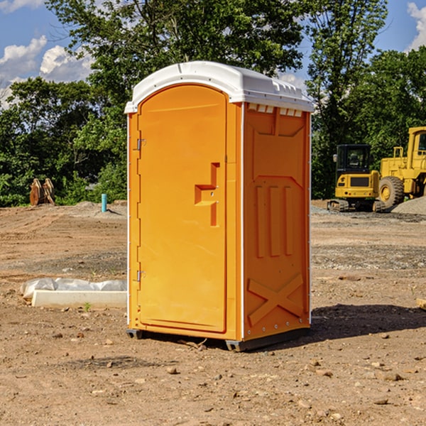 what is the cost difference between standard and deluxe portable restroom rentals in Abie NE